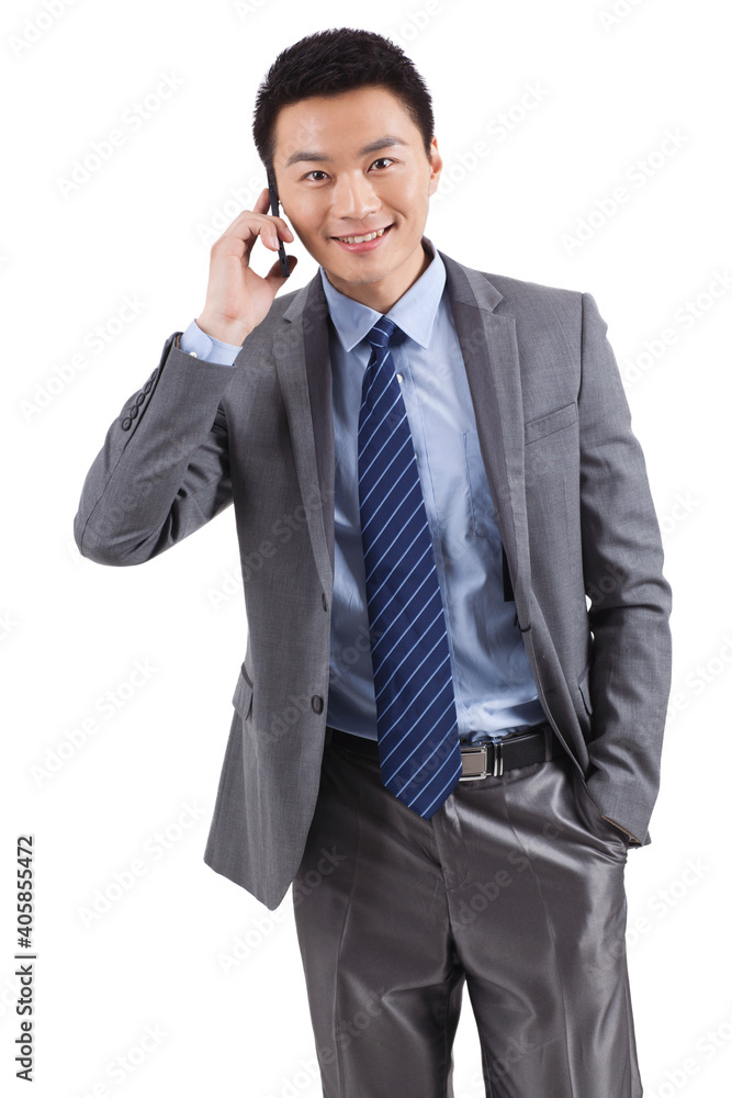 Portrait of young businessman talking on cell phone Portrait of young businessman talking on cell phone