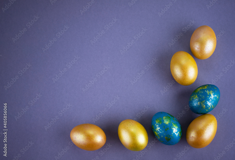 Bright colored eggs on a gray background. Easter theme, holiday. Happy easter card with copy space for text in minimalist easter style. Color of the year. Grey. Bright colored eggs on a gray background. Easter theme, holiday. Happy easter card with copy space for text in minimalist easter style. Color of the year. Grey.