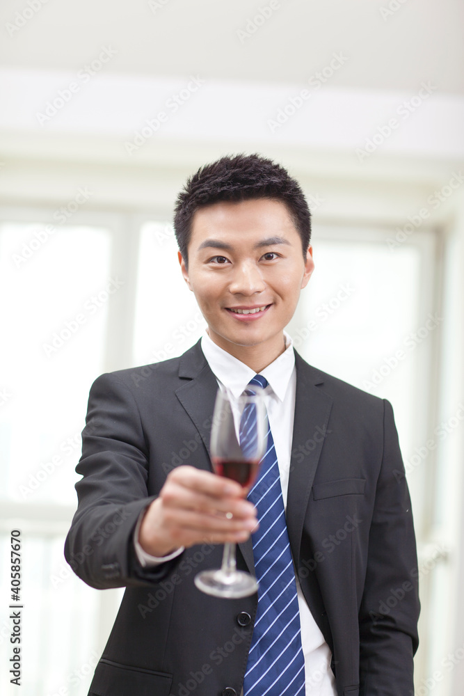 Portrait of businessman holding a glass of wine Portrait of businessman holding a glass of wine