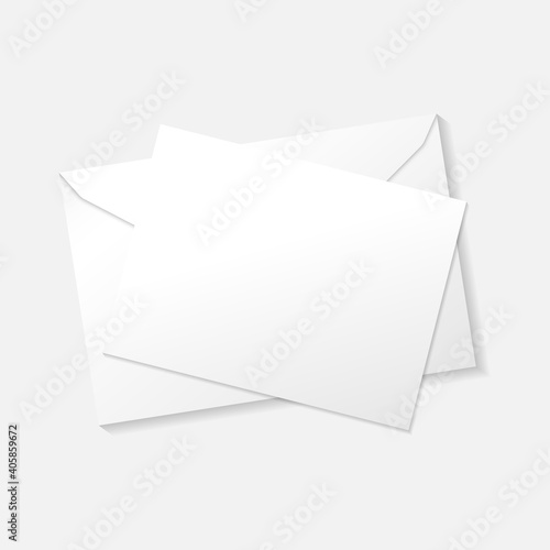 White greeting card on envelope flat lay top view mockup template. Isolated on white background with shadow.