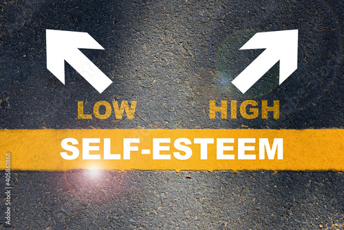 Fényképezés Self-esteem written on yellow line with low and high with white arrow on asphalt road