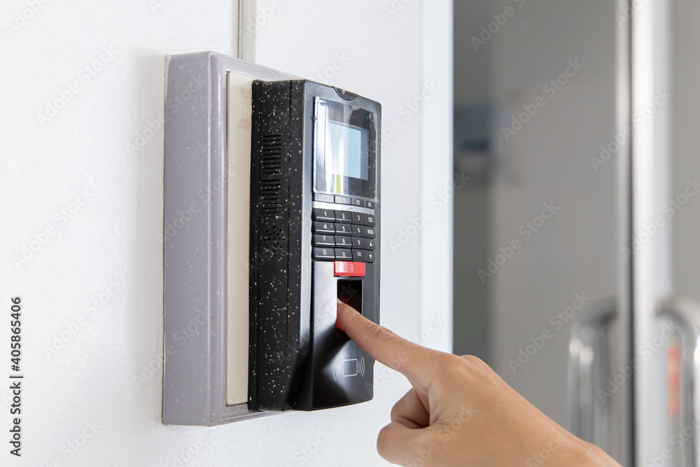 Finger print scan, Male employees press sensors to record company attendance time and after work, Time Recorder Attendance - Out work, Encryption for identity verification or electronic signing Finger print scan, Male employees press sensors to record company attendance time and after work, Time Recorder Attendance - Out work, Encryption for identity verification or electronic signing