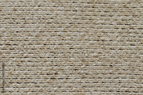 The texture of a light knitted sweater fabric. 