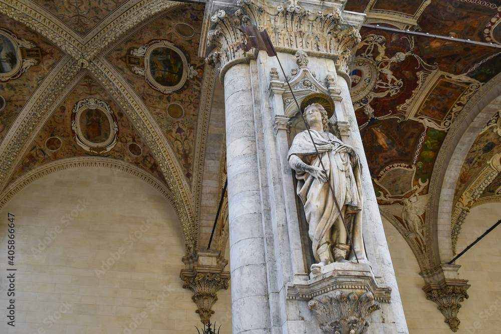 Detail of the Loggia della Mercanzia (15th c.) with the statue of Saint Ansano by Antonio Federighi, Siena, Tuscany, Italy