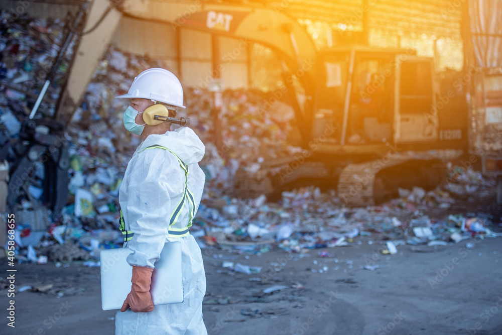 Waste processing plant. Technological process plastic bottles at the factory for processing and recycling. The worker recycling factory,engineers is out of focus or blurred. Waste processing plant. Technological process plastic bottles at the factory for processing and recycling. The worker recycling factory,engineers is out of focus or blurred.