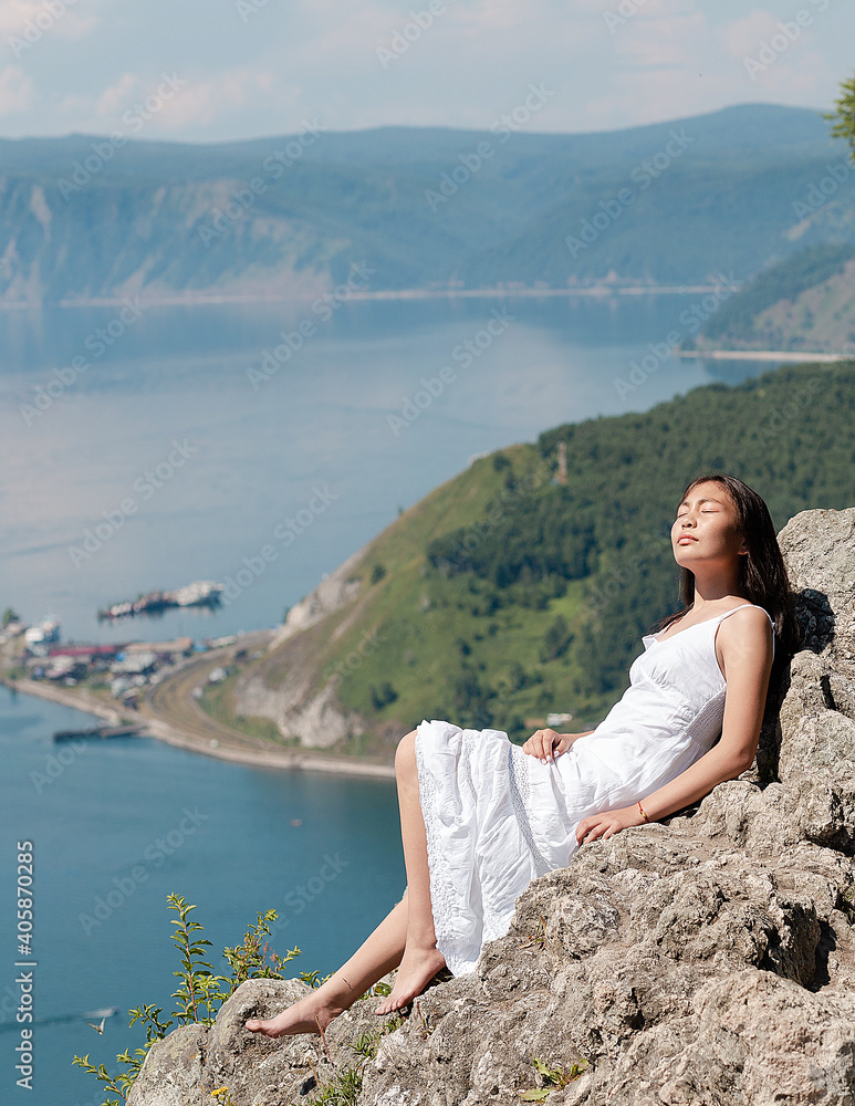 A girl of Buryat appearance on Lake Baikal
