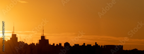 Silhouette of the buildings of city of São José do Rio Preto with sunset and orange sky - Sao Jose do Rio Preto - Sao Paulo - Brasil
