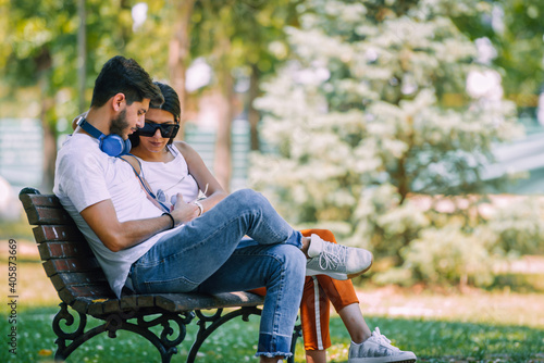 Love couple leisure on bench, romantic meeting photo