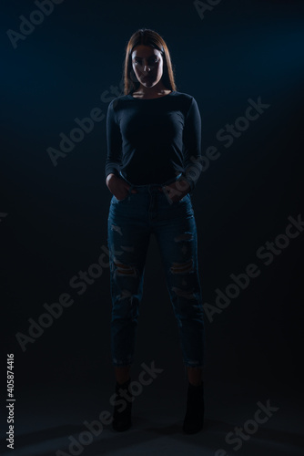 Silhouette picture of beautiful woman posing on black background