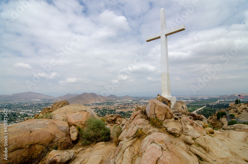 Beautiful shot of the cross on a rocky mountain of Mount Rubidoux in California photo