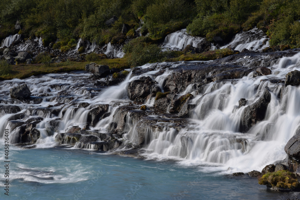 Hraunfossar waterfalls cascading into the Hvítá river over ledges of lava rock