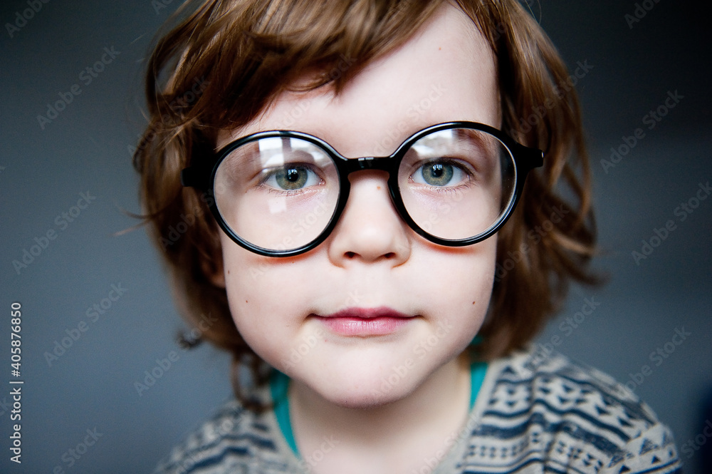 Portrait of a cute child in vision-correcting glasses. Portrait of a cute child in vision-correcting glasses.