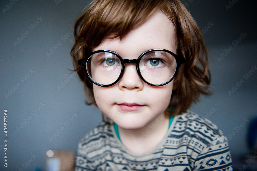 Portrait of a cute child in vision-correcting glasses. Portrait of a cute child in vision-correcting glasses.