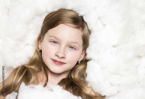 Portrait of a girl in the clouds. Child on a white background.