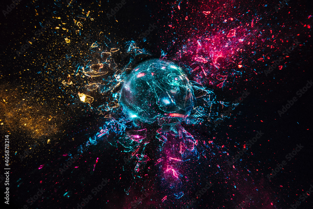 explosion of a glass ball with colored lights, black background. - obrazy, fototapety, plakaty 