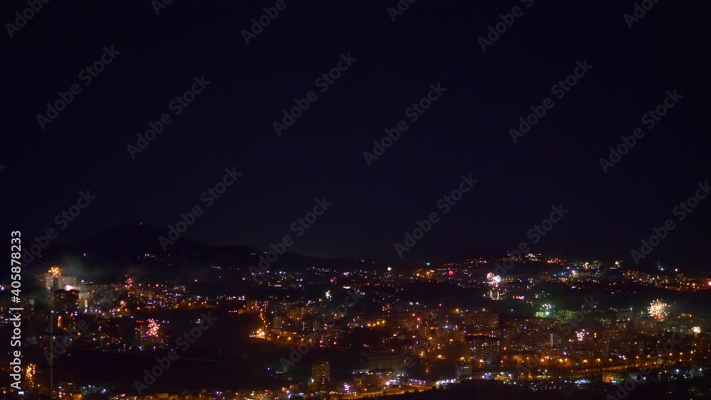 many flashes of fireworks over the night city. general holiday. many flashes of fireworks over the night city. general holiday.