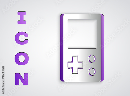 Paper cut Portable tetris electronic game icon isolated on grey background. Vintage style pocket brick game. Interactive playing device. Paper art style. Vector.