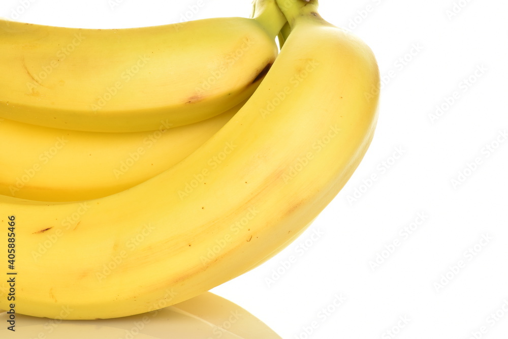 Several ripe yellow bananas, close-up, isolated on white.