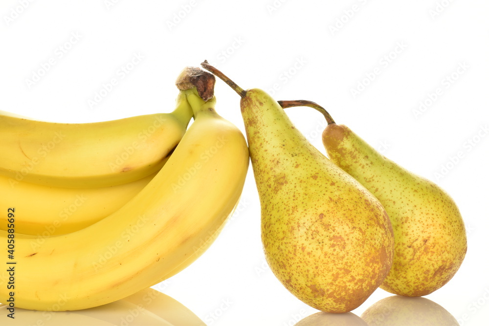 Several ripe yellow bananas and two sweet pears, close-up, isolated on white. Several ripe yellow bananas and two sweet pears, close-up, isolated on white.