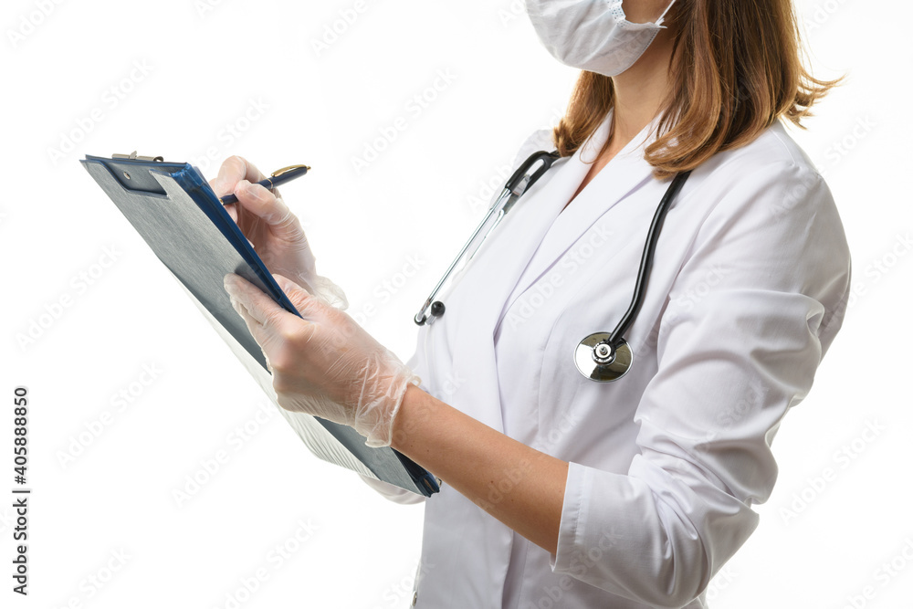 The doctor writes in a clipboard with a ballpoint pen The doctor writes in a clipboard with a ballpoint pen