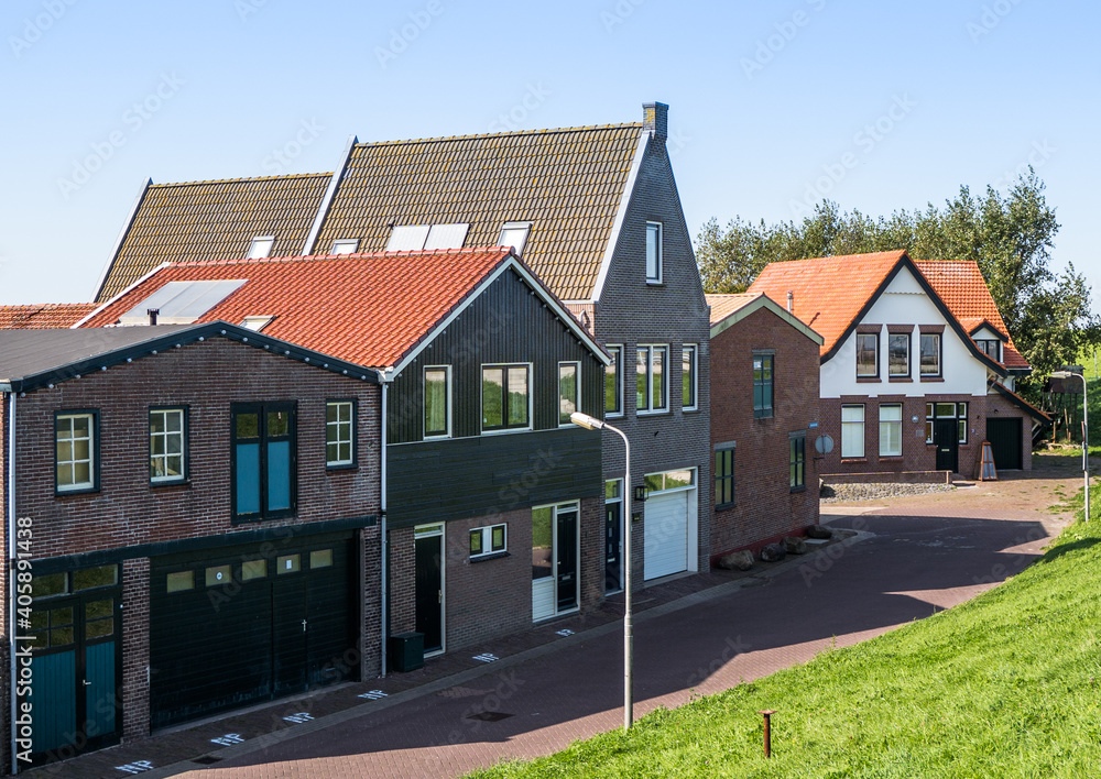 Dutch homes by the seaside in Den Oever, Netherlands.