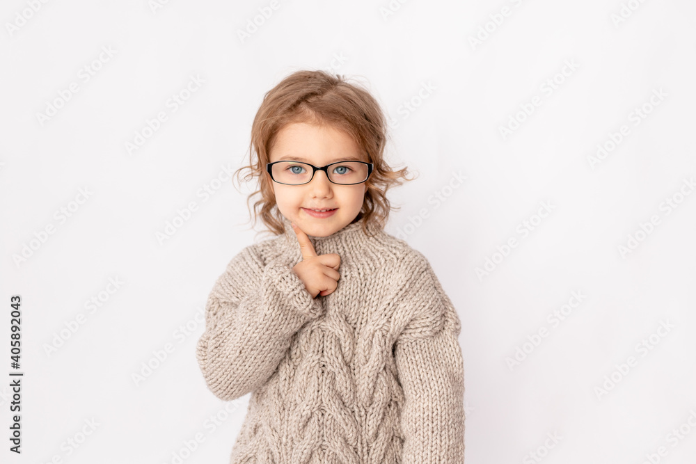 surprised child girl with glasses on white background, space for text