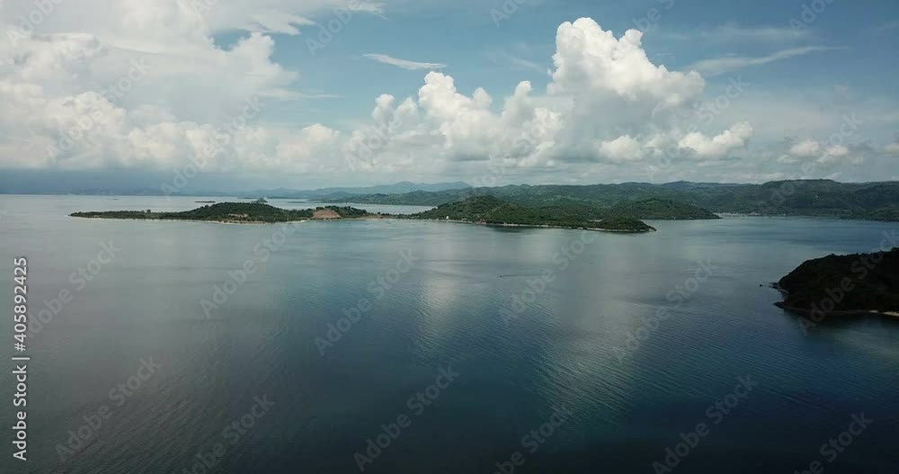 aerial seascape, tropical vacation and island hopping concept. Gilli air island and Lombok . Indonesia, south Gili islands. Gili Asahan island. A strip of sand on the beach and blue sea with corals aerial seascape, tropical vacation and island hopping concept. Gilli air island and Lombok . Indonesia, south Gili islands. Gili Asahan island. A strip of sand on the beach and blue sea with corals