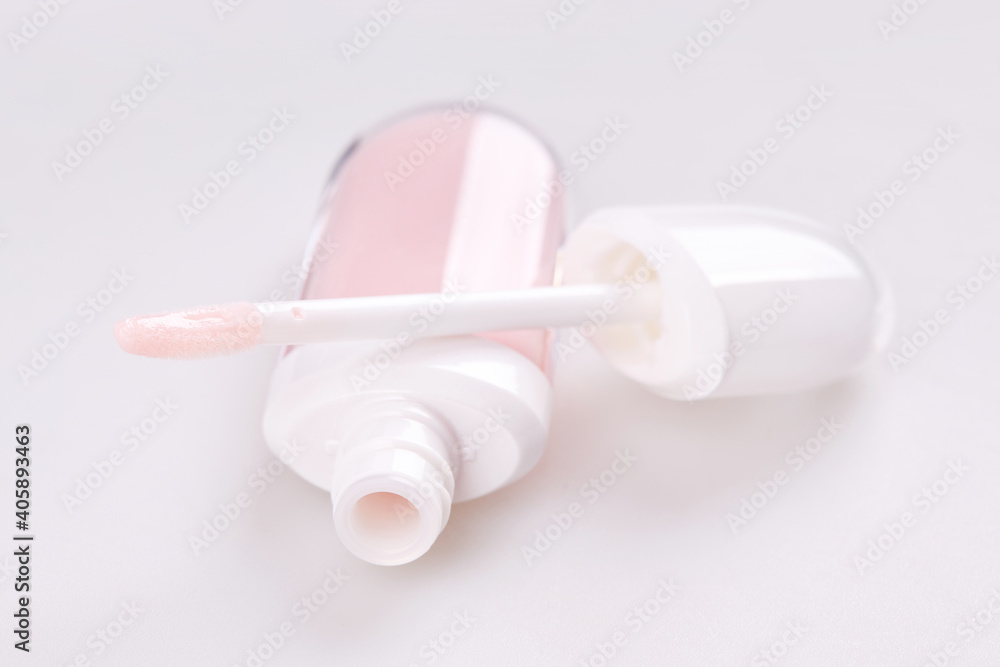 Tube of liquid lipstick gloss with applicator isolated on white background Tube of liquid lipstick gloss with applicator isolated on white background