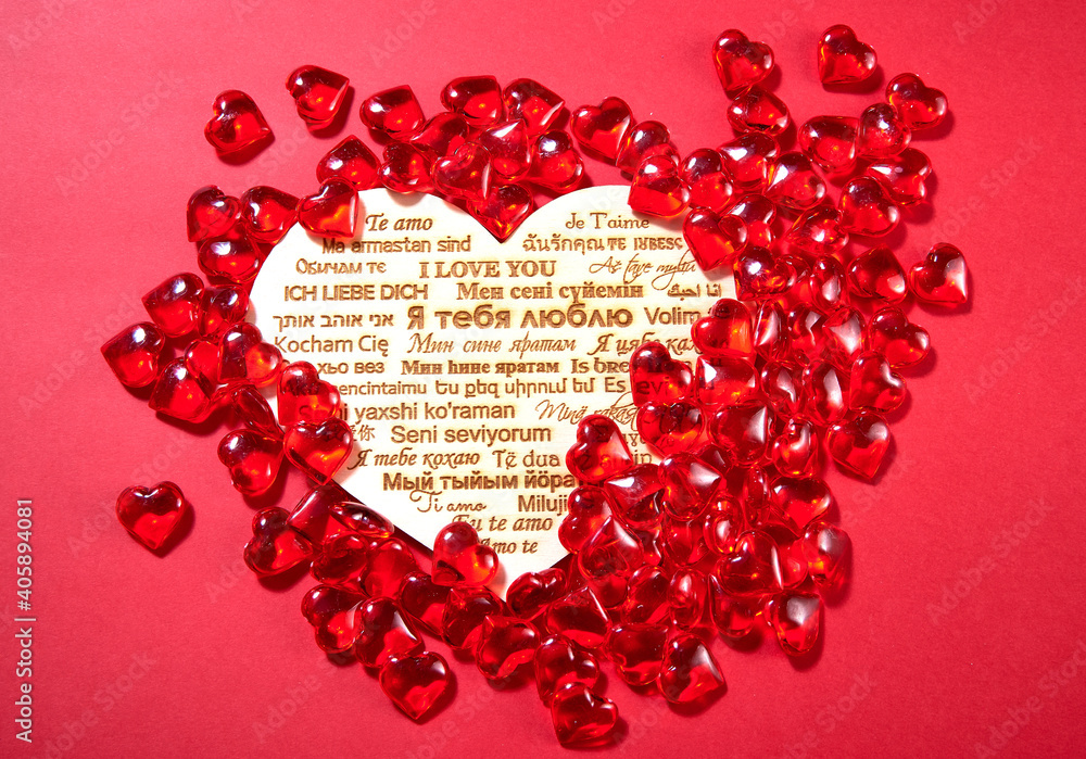 candy in the shape of hearts on a red background. the inscription candy in the shape of hearts on a red background. the inscription