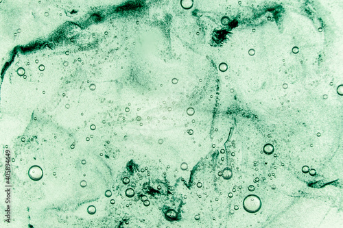 Liquid cream gel, green blue cosmetic texture with bubbles