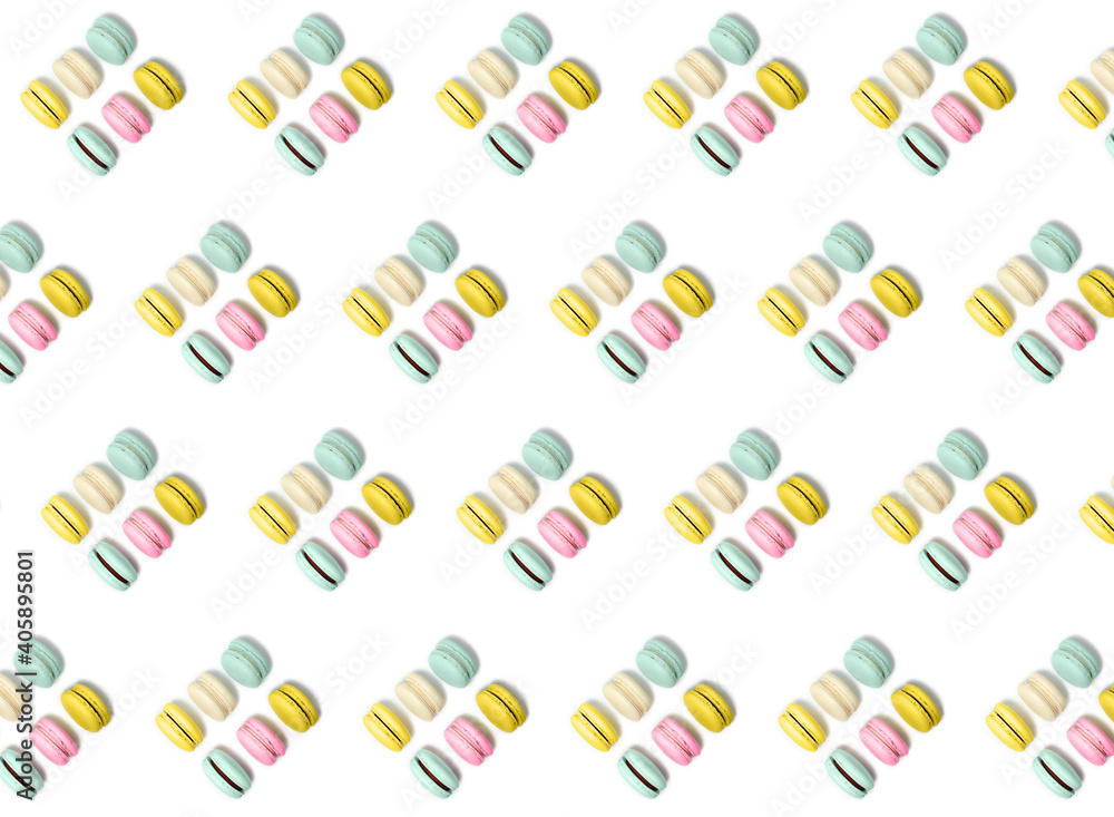 Almond cookies, in pastel colors on a white background. Traditional French multicolored dessert, close-up. pattern Almond cookies, in pastel colors on a white background. Traditional French multicolored dessert, close-up. pattern
