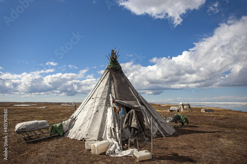 Ethnography. The house of the northern inhabitants of the Arctic on a background of clouds. Spring in the tundra