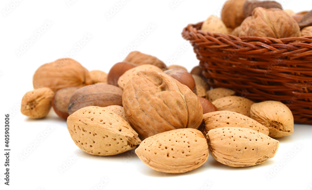 Mixed nuts selection of Brazil,almonds,waln ut and hazelnuts in basket on white Mixed nuts selection of Brazil,almonds,waln ut and hazelnuts in basket on white