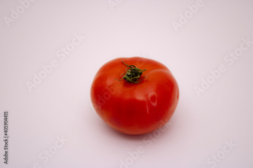 Red ripe tomato on a white background.