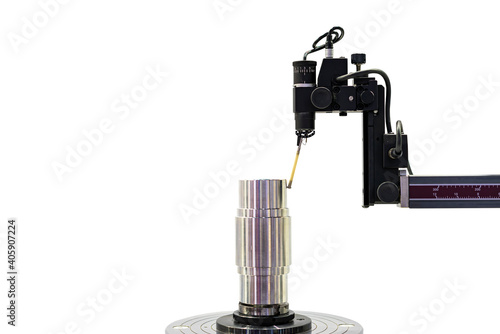 Fototapeta Naklejka Na Ścianę i Meble -  Machining cylindrical metal part set on work turntable on roundness cylindricity and straightness measuring tester machine and during inspection isolated on with clipping path