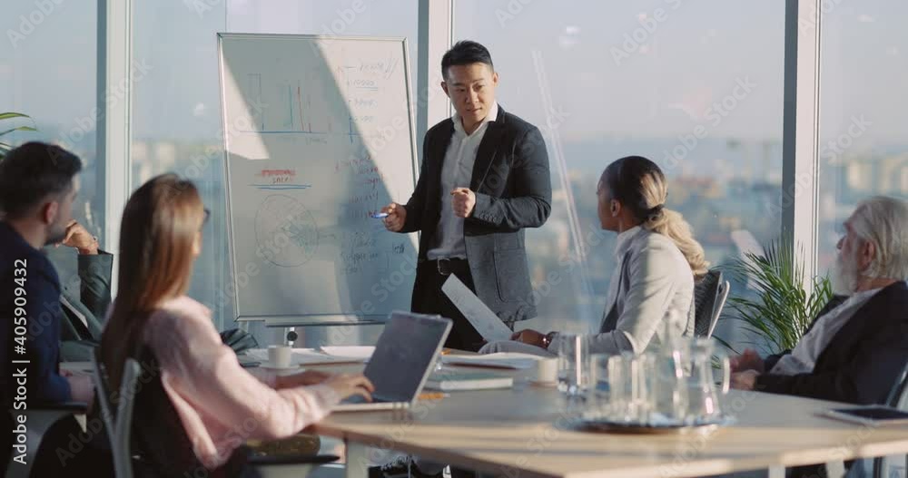 Brainstorming. Afro-american and chinese business colleagues communicating asking questions during business meeting conversation in office room.