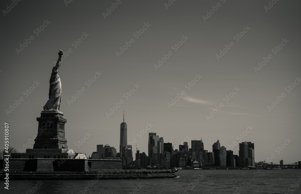 Liberty Island with New York Cityscape in the background, Statue of Liberty, black and white