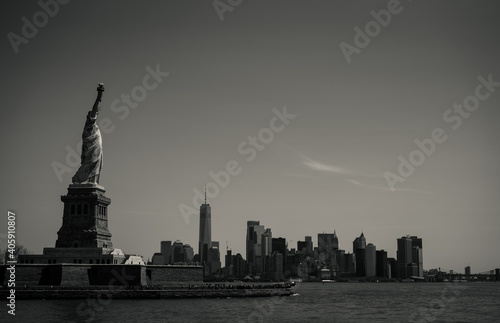 Liberty Island with New York Cityscape in the background, Statue of Liberty, black and white © Evan