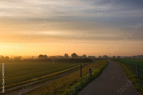 famous dutch cycling path early in the morning at sunrise