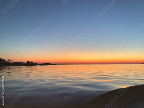 Hermoso paisaje  el amanecer salida del sol desde el rio Amazonas  Iquitos - Per  