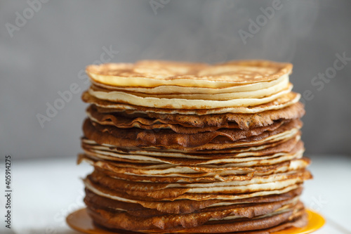 Shrovetide Maslenitsa Butter Week festival meal. Stack of russian pancakes blini. Rustic style, close up view photo