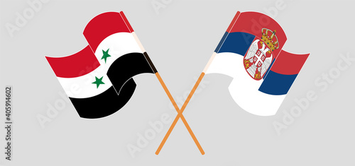 Crossed and waving flags of Syria and Serbia
