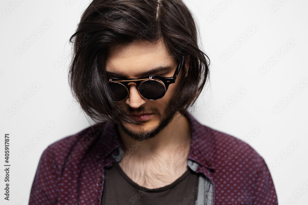 Portrait of hipster young guy with sunglasses on white background. Portrait of hipster young guy with sunglasses on white background.