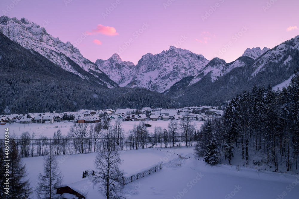 Winter and snow in Kranjska Gora village, Slovenia. Dusk or night panorama.