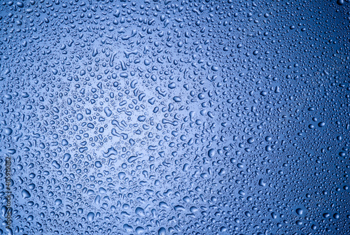 water drops on glass on blue background