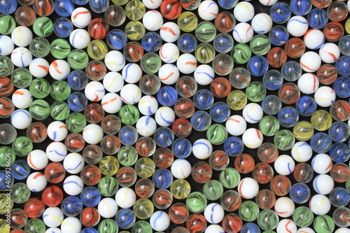 Red Yellow Green White and Blue Marbles in a pattern