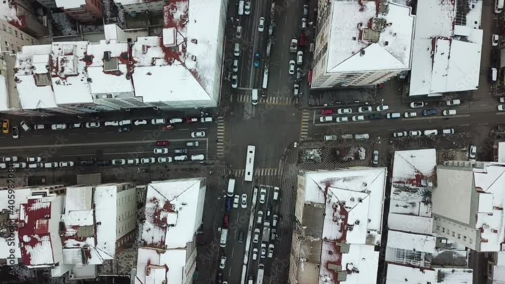 Aerial view of snowy buildings and city roads at the winter. Aerial view of snowy buildings and city roads at the winter.