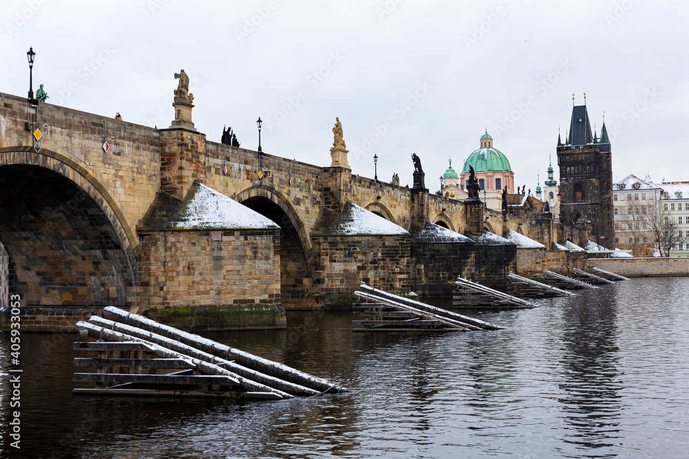 Snowy Prague Old Town with Charles Bridge above River Vltava, Czech republic