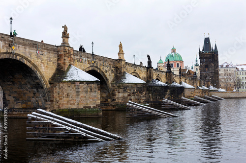 Snowy Prague Old Town with Charles Bridge above River Vltava, Czech republic