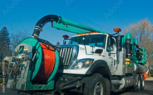 Truck for laying underground cable equipped with a sucking apparatus for cleaning the passageway. St Paul Minnesota MN USA